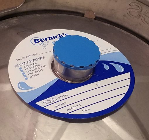 custom printed 2 color keg color on waterproof stock placed on a keg with blue vented keg cap