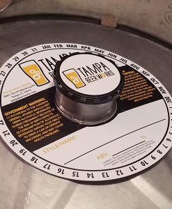 custom printed 2 color keg collar placed on keg with black keg cap and keg cap sticker